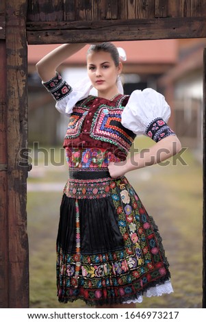 Young beautiful slovak woman in traditional costume
