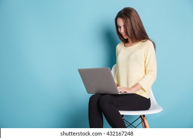 Young Beautiful Smart Woman Using Laptop Pc Computer For Study Isolated On The Blue Background