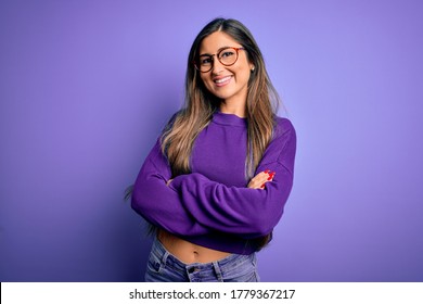 Young Beautiful Smart Woman Wearing Glasses Over Purple Isolated Background Happy Face Smiling With Crossed Arms Looking At The Camera. Positive Person.