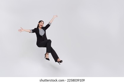 Young beautiful smiling asian businesswoman floating in mid-air and announcement something isolated on white background.