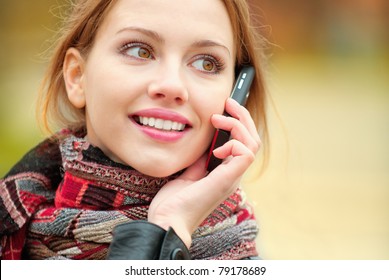 Young Beautiful Smiling Woman Talking On Cell Phone