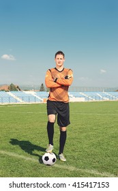 young and beautiful soccer player posing at the stadium, trains and enjoy the beautiful sunny day