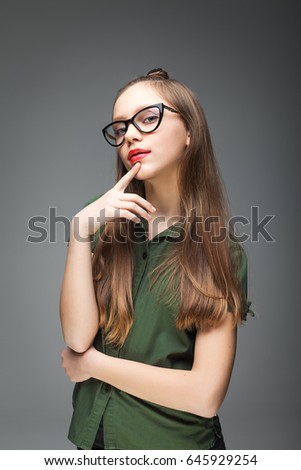 Young beautiful spectacled girl