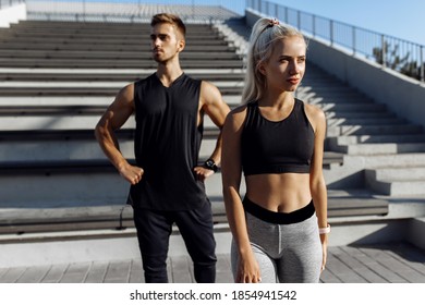 Young beautiful sportive couple, in sportswear, doing sports exercises outdoors, sport, healthy lifestyle - Powered by Shutterstock