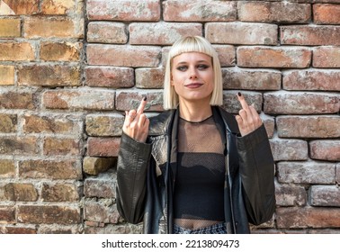 Young Beautiful Strong Independent Rebel Blonde Woman Punk Music And Style Fan Posing. Confident Punk-Rock Youth Culture Concept.