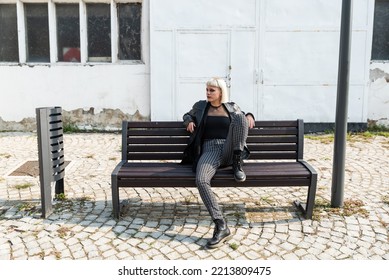 Young Beautiful Strong Independent Rebel Blonde Woman Punk Music And Style Fan Posing. Confident Punk-Rock Youth Culture Concept.