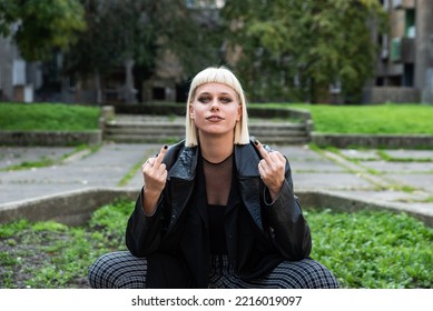 Young Beautiful Strong Independent Rebel Blonde Woman Punk Music And Style Fan Posing. Confident Punk-Rock Youth Culture Street Style Concept.	