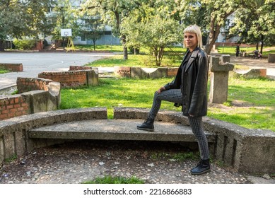 Young Beautiful Strong Independent Rebel Blonde Woman Punk Music And Style Fan Posing. Confident Punk-Rock Youth Culture Street Style Concept.