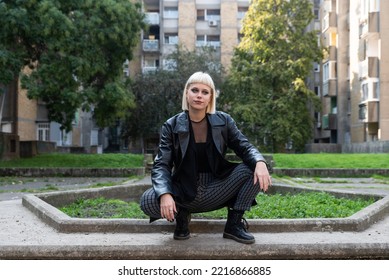 Young Beautiful Strong Independent Rebel Blonde Woman Punk Music And Style Fan Posing. Confident Punk-Rock Youth Culture Street Style Concept.