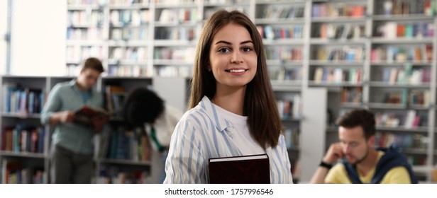 Young Beautiful Student With Book In Library. Banner Design