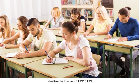 Young beautiful students studying in the classroom - Shutterstock ID 312210122