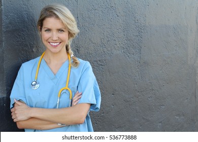 Young beautiful successful female doctor with stethoscope - portrait with copy space