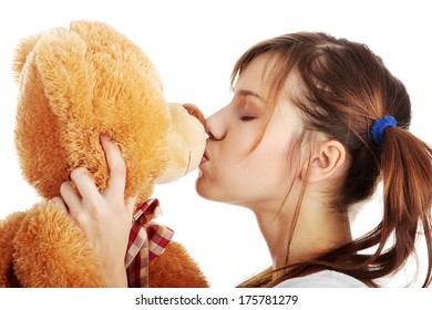 Young Beautiful Teen Woman In Long Shirt With Her Teddy Bear, Isolated On White Background