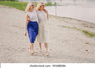 young beautiful twins, walk and enjoy the beautiful weather