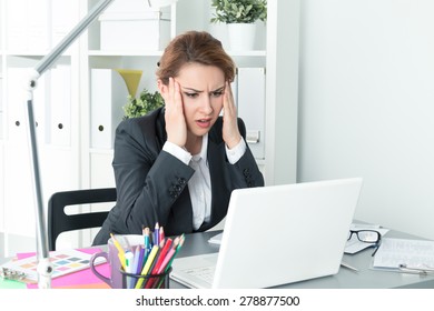 Young Beautiful Upset Business Woman Trying To Concentrate Looking At Laptop Monitor