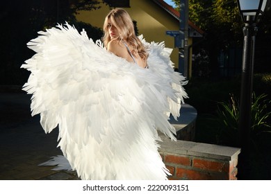 A Young Beautiful Woman Angel With White Wings