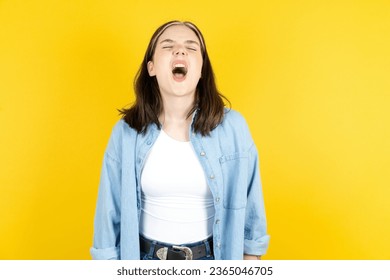 young beautiful woman angry and mad screaming frustrated and furious, shouting with anger. Rage and aggressive concept. - Shutterstock ID 2365046705