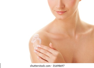 Young Beautiful Woman Applying Moisturizer To Her Skin After Shower