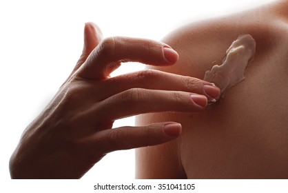 Young beautiful woman applying moisturizing cream for body - Shutterstock ID 351041105