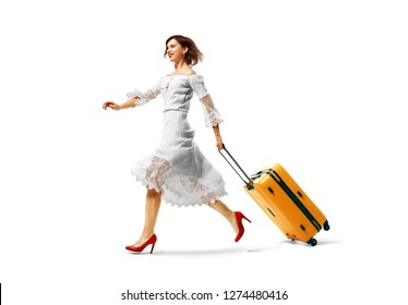 young beautiful woman arrived on vacation.Traveling very happy wallking with suitcase. isolated background