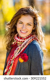 Young Beautiful Woman In Autumn Park