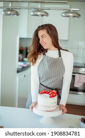Young Beautiful Woman Bakes A Cake. Sweets.