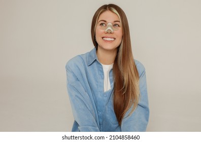 A Young Beautiful Woman With A Bandage On Her Nose After Rhinoplasty