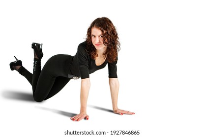 Young Beautiful Woman In Black Suit Posing Standing On All Fours In The Studio On White Background