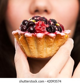 Young Beautiful Woman With A Cake. Close-up Studio Portrait.