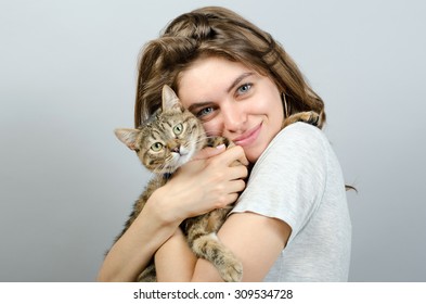 Young Beautiful Woman With Cat