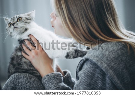 Young beautiful woman with cat. High quality photo