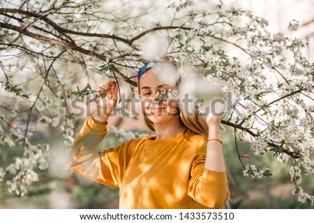 Similar – Woman with sunglasses touching over nature background