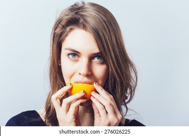 Young Beautiful Woman With Citrus Orange Fruit Having Fun. 