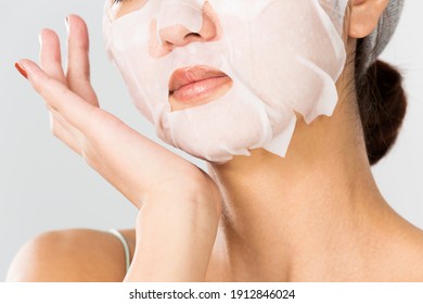 Young and beautiful woman with a clean mask on her face.