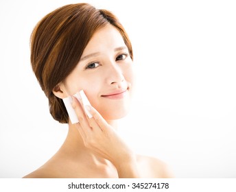 Young Beautiful Woman Cleaning Face By Cotton