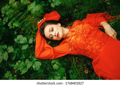 young, beautiful woman with clear, sparkling skin on her face and body is lying in a tropical forest. Natural organic skin care. The concept of harmony with nature. - Shutterstock ID 1768401827