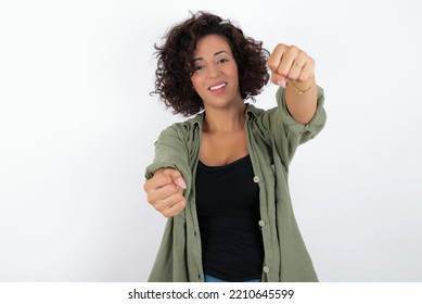 Young Beautiful Woman With Curly Short Hair Wearing Green Overshirt Over White Wall  Imagine Steering Wheel Helm Rudder Passing Driving Exam Good Mood Fast Speed