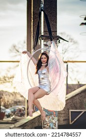 Young Beautiful Woman Dancing On An Aerial Ring Outside