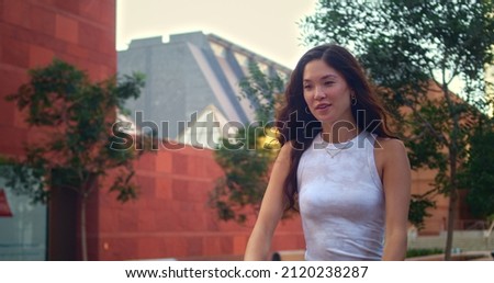 Similar – Image, Stock Photo Girl using electric scooter in the street in downtown rented by using service on smartphone. Candid people, real moments, authentic situations