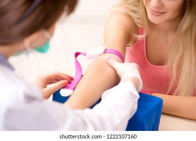 Young Beautiful Woman During Blood Test Sampling Procedure 