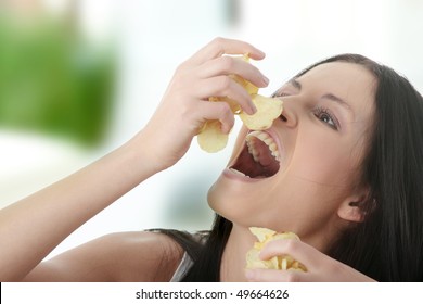 Young Beautiful Woman Eating Chips