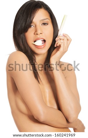 Young beautiful woman eating garlic. Healthy eating concept. Natural antibiotic that fight infection 