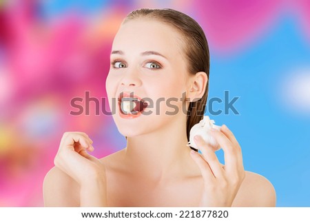 Young beautiful woman eating garlic. Healthy eating concept. Natural antibiotic that fight infection