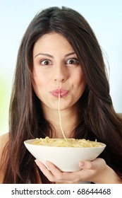 Young Beautiful Woman Eating Spaghetti