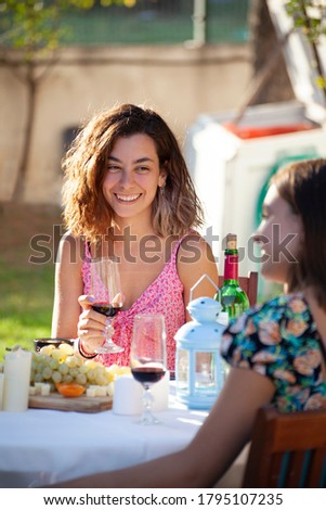 Similar – Frau beim Biertrinken im Grill mit Freunden