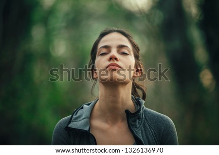 Young beautiful woman exercise in the forest