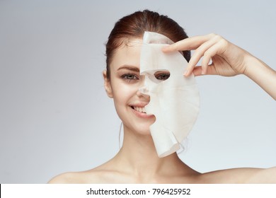   young beautiful woman in a face mask, skin care                             
