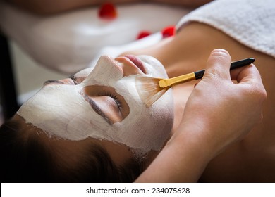 Young Beautiful Woman With Facial Mask, Spa Treatment 