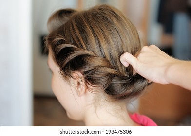 Young Beautiful Woman Getting Her Hair Done 