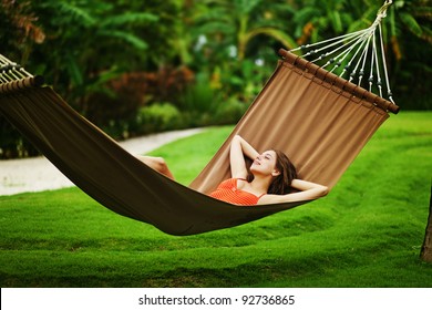 Young beautiful woman in hammock, Bali, Indonesia - Powered by Shutterstock